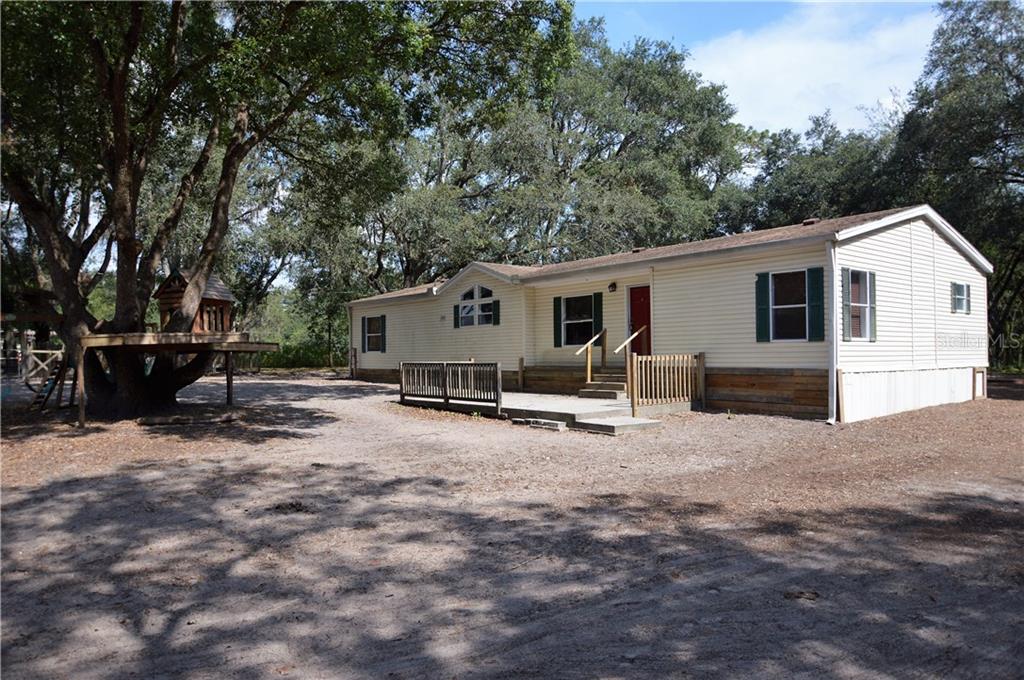 3146 Allen Road Zephyrhills, FL 33541 - Photo 1 of 1 Front exterior with concrete patio