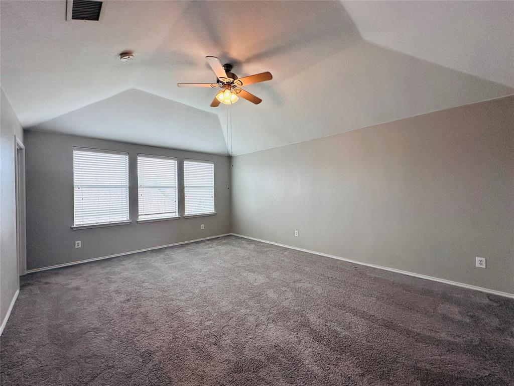 213 Spruce Trail Forney, TX 75126 - Photo 11 of 19 an empty room with windows and fan