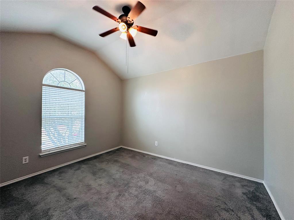 213 Spruce Trail Forney, TX 75126 - Photo 15 of 19 an empty room with windows and fan