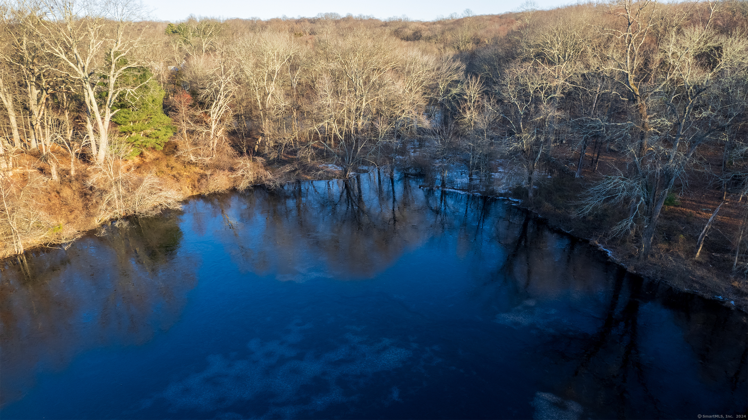 1375 Westport Turnpike Fairfield, CT 06824 - Photo 5 of 6 a view of a lake with mountains in the background