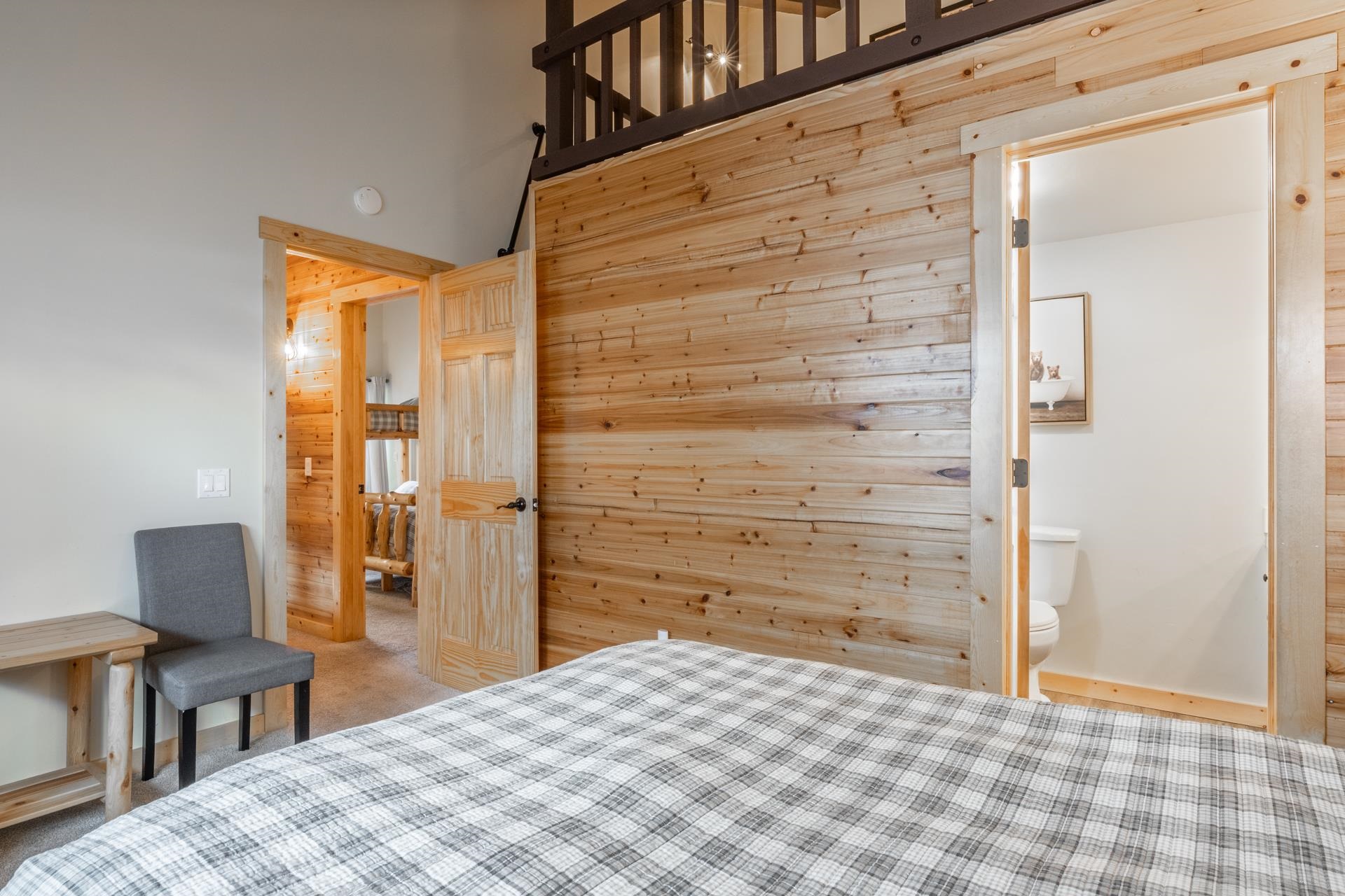 150 Sierra Park Road, Unit 6 Mammoth Lakes, CA 93546 - Photo 16 of 31 Bedroom featuring wooden walls, ensuite bath, and carpet floors