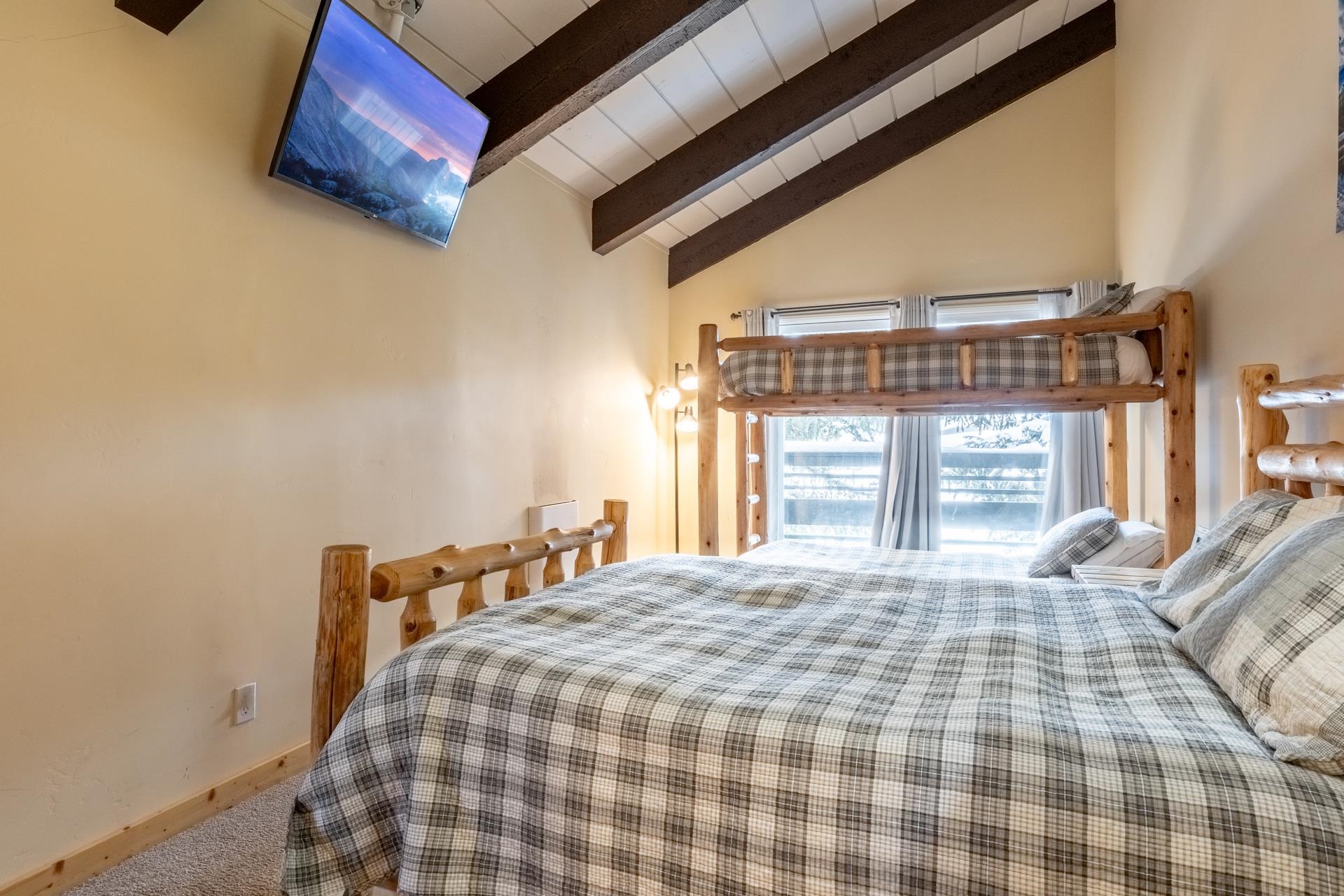 150 Sierra Park Road, Unit 6 Mammoth Lakes, CA 93546 - Photo 24 of 31 Bedroom featuring vaulted ceiling with beams and carpet