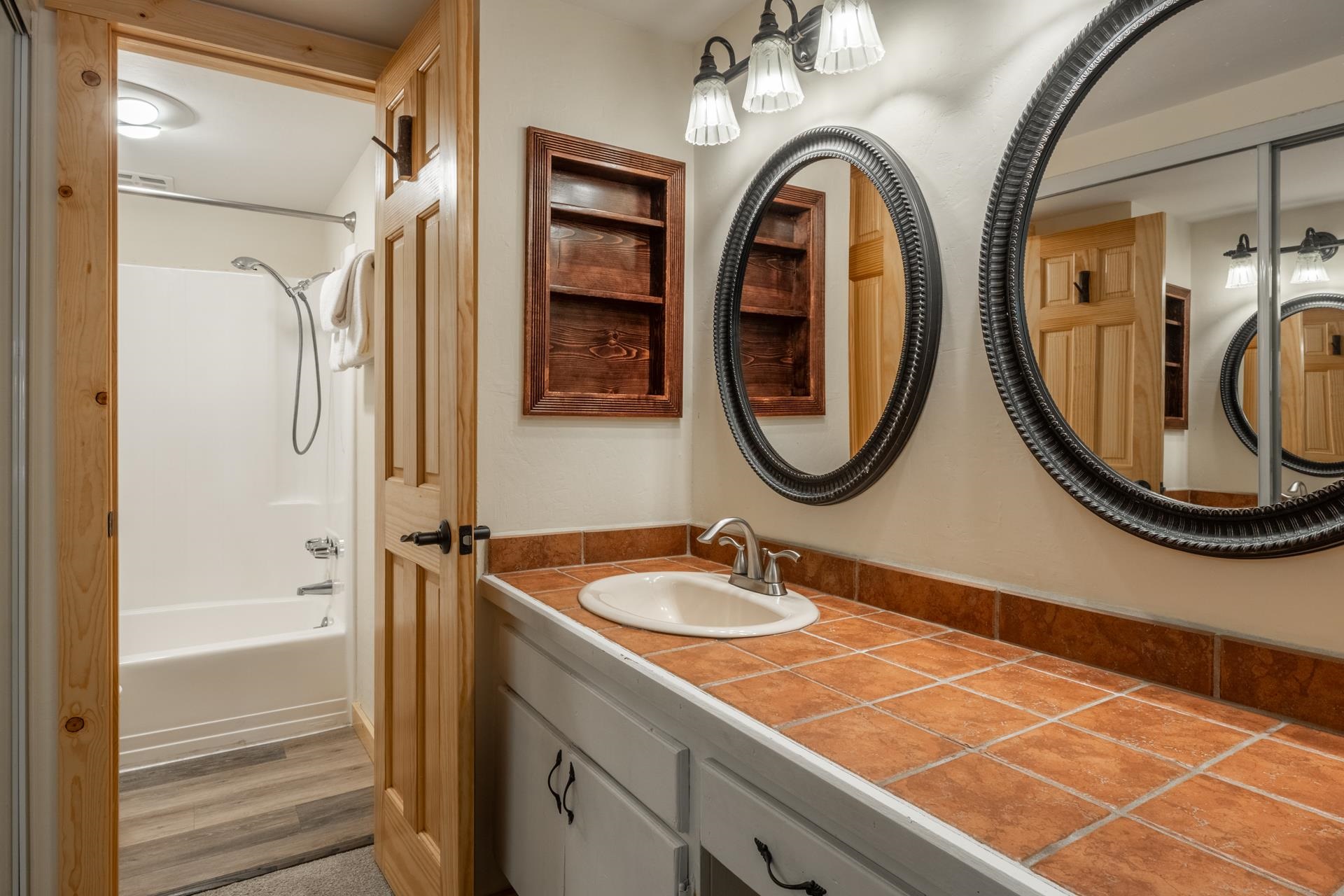 150 Sierra Park Road, Unit 6 Mammoth Lakes, CA 93546 - Photo 27 of 31 Full bathroom featuring shower / washtub combination, vanity, and light wood-style floors
