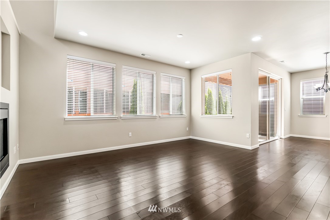 3608 177th Street Southeast Bothell, WA 98012 - Photo 8 of 32 a view of an empty room with wooden floor and a window