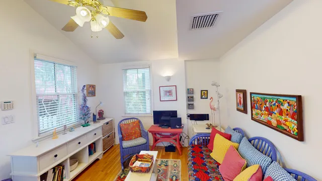 a living room with fireplace furniture and a flat screen tv