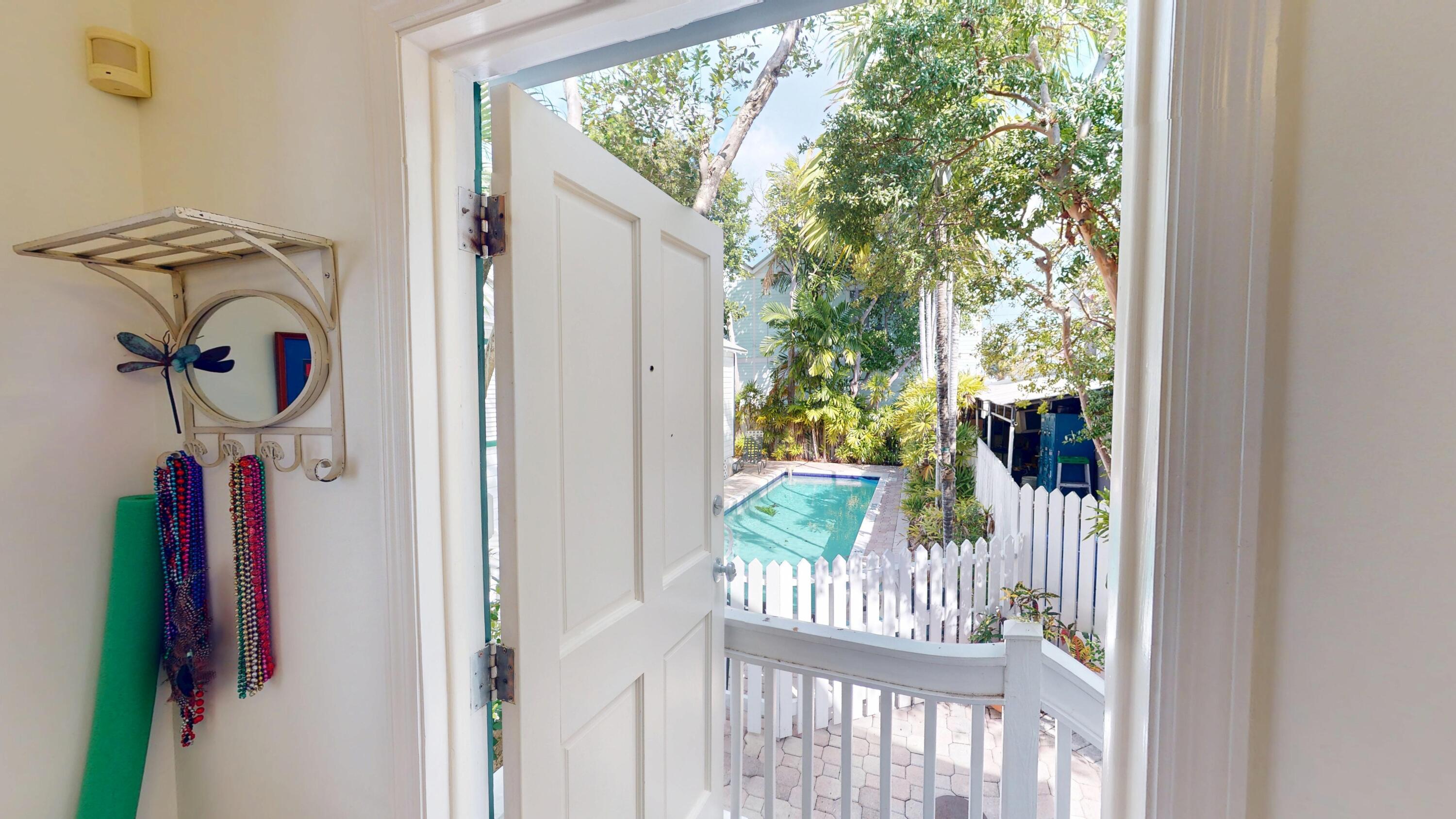 308 Margaret Street, Unit 2 Key West, FL 33040 - Photo 6 of 7 a view of a porch with furniture and floor to ceiling window