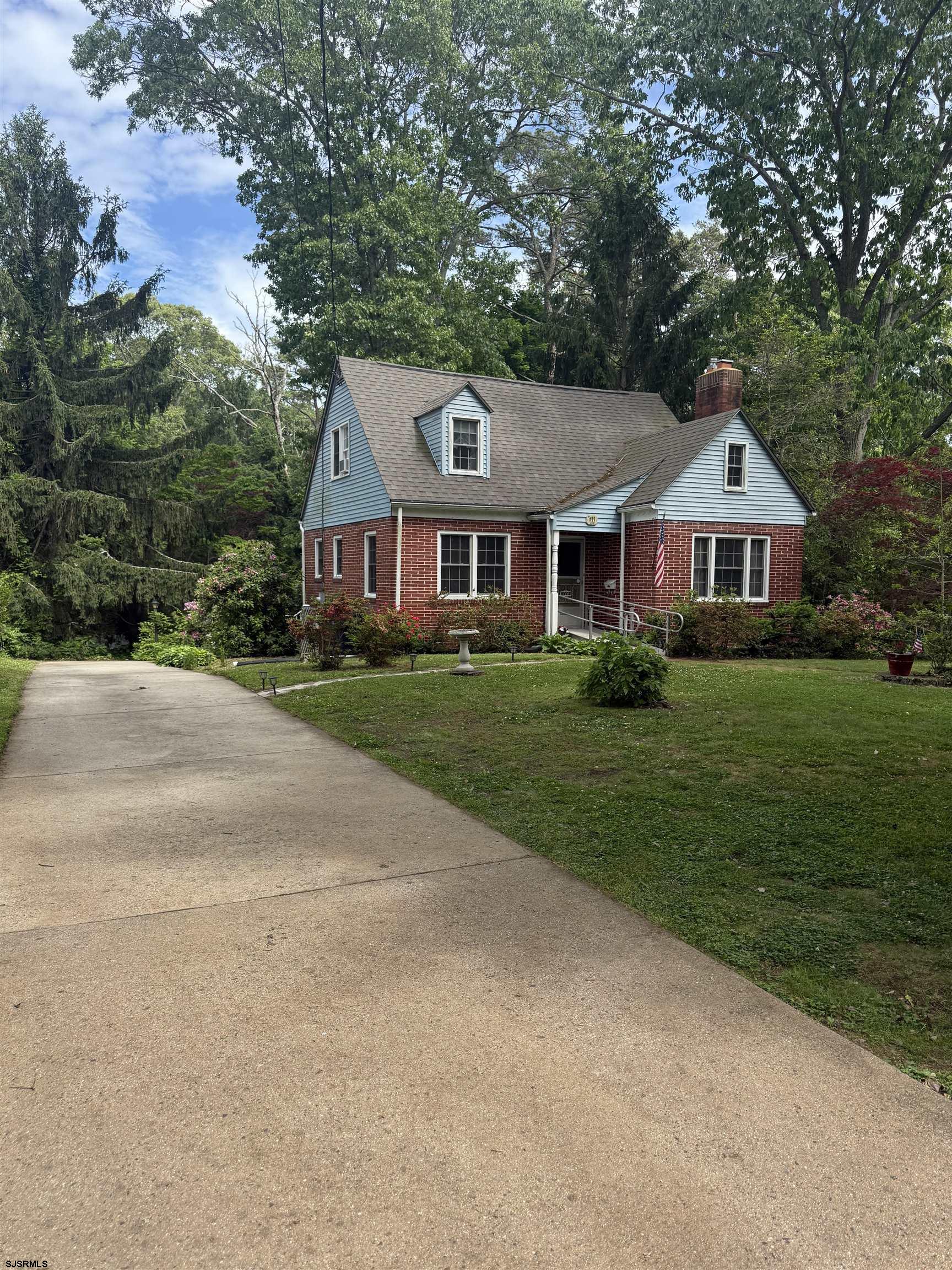 144 Pitney Road Absecon, NJ 08201 - Photo 2 of 47 front view of a house with a yard