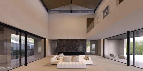 a living room with a couch and a ceiling fan