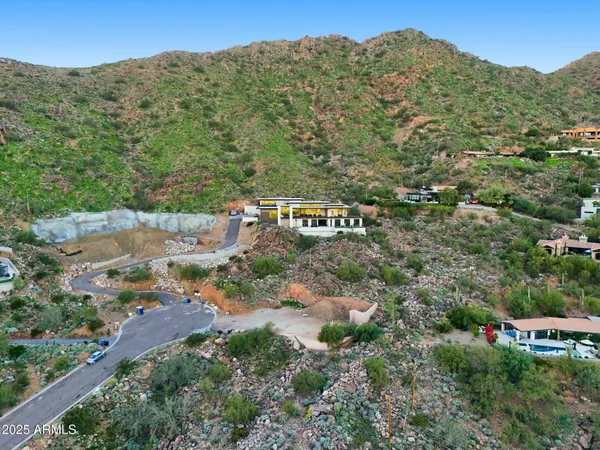 an aerial view of a house with a yard