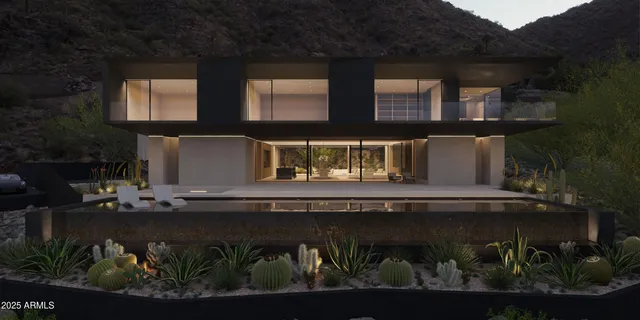 a front view of house with a garden