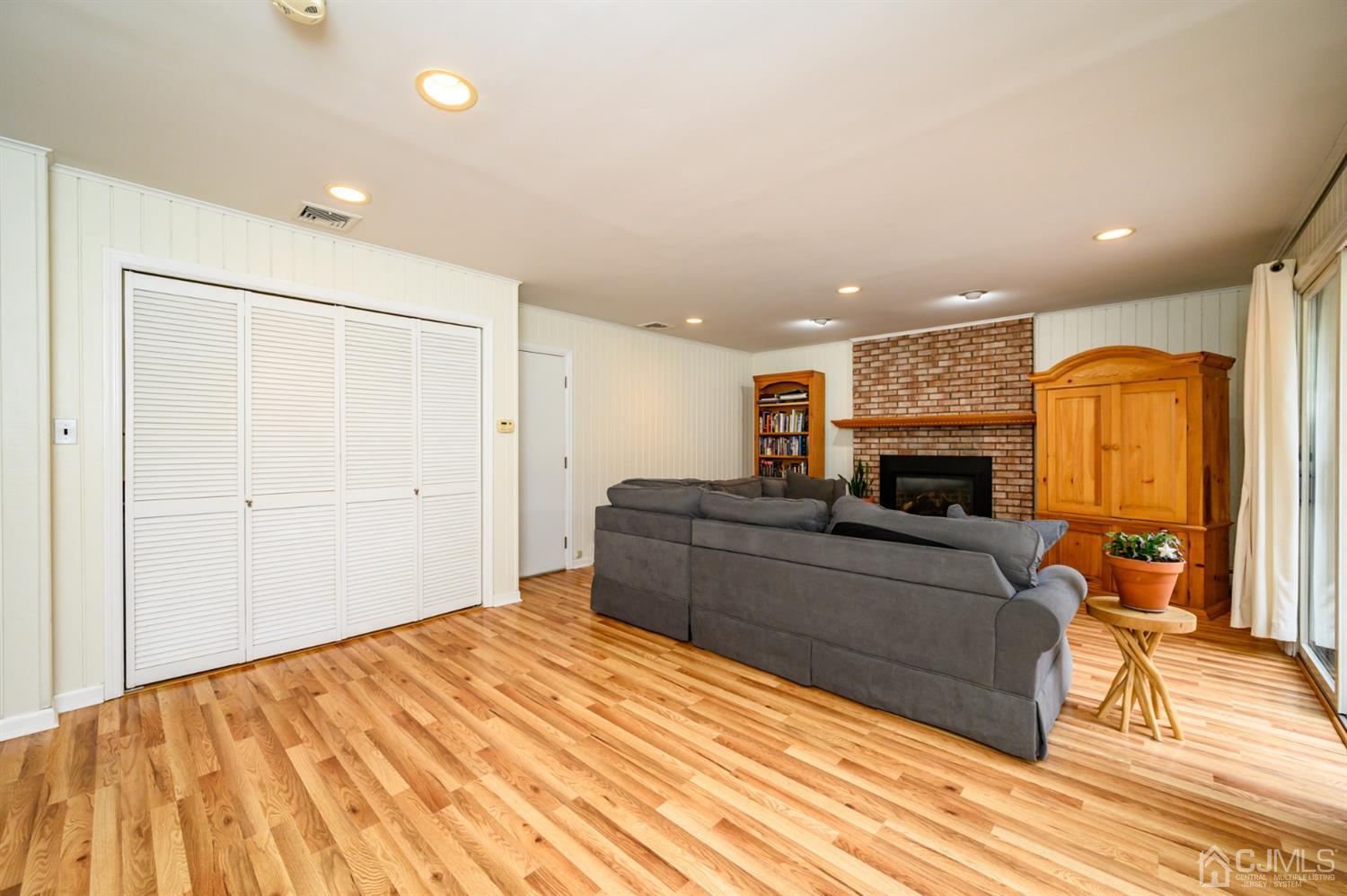 24 Clover Lane Randolph, NJ 07869 - Photo 19 of 59 a living room with a couch and a fireplace