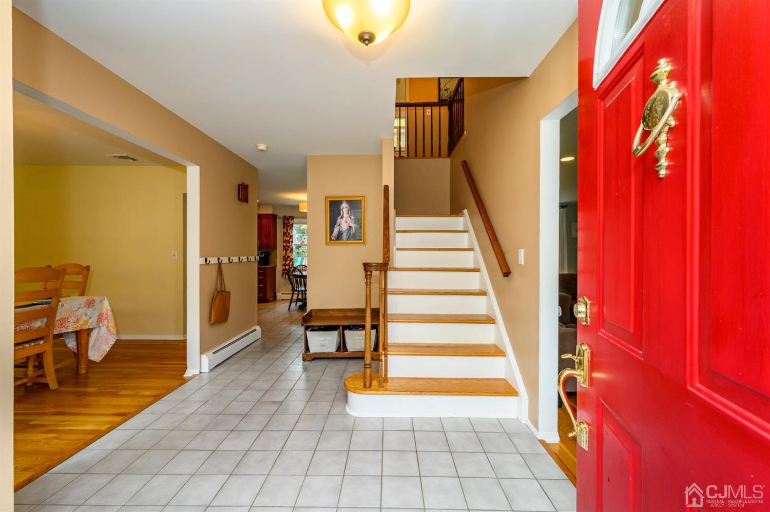 24 Clover Lane Randolph, NJ 07869 - Photo 3 of 59 a view of entryway and hall with wooden floor