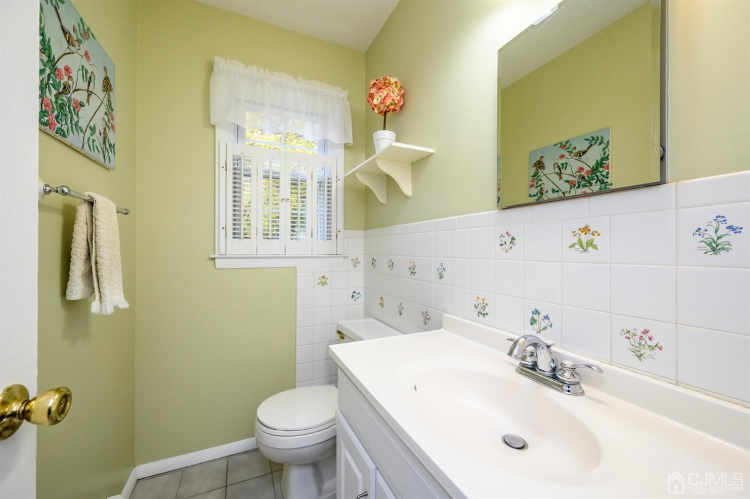 24 Clover Lane Randolph, NJ 07869 - Photo 21 of 59 a bathroom with a sink and mirror with toilet