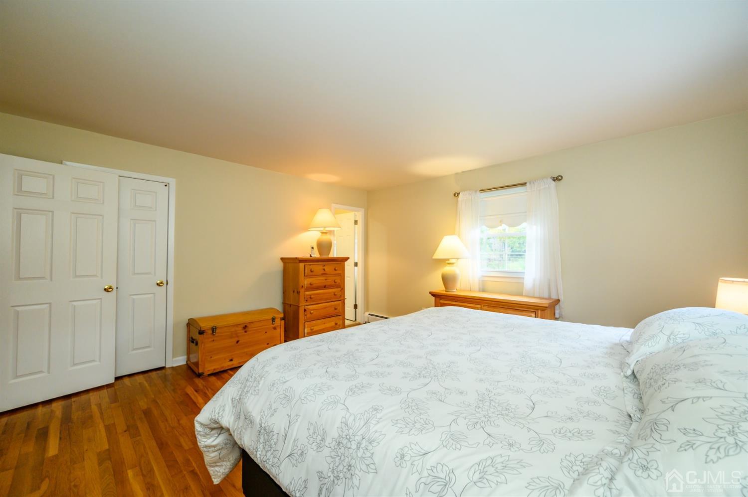 24 Clover Lane Randolph, NJ 07869 - Photo 25 of 59 a bedroom with a bed and a window