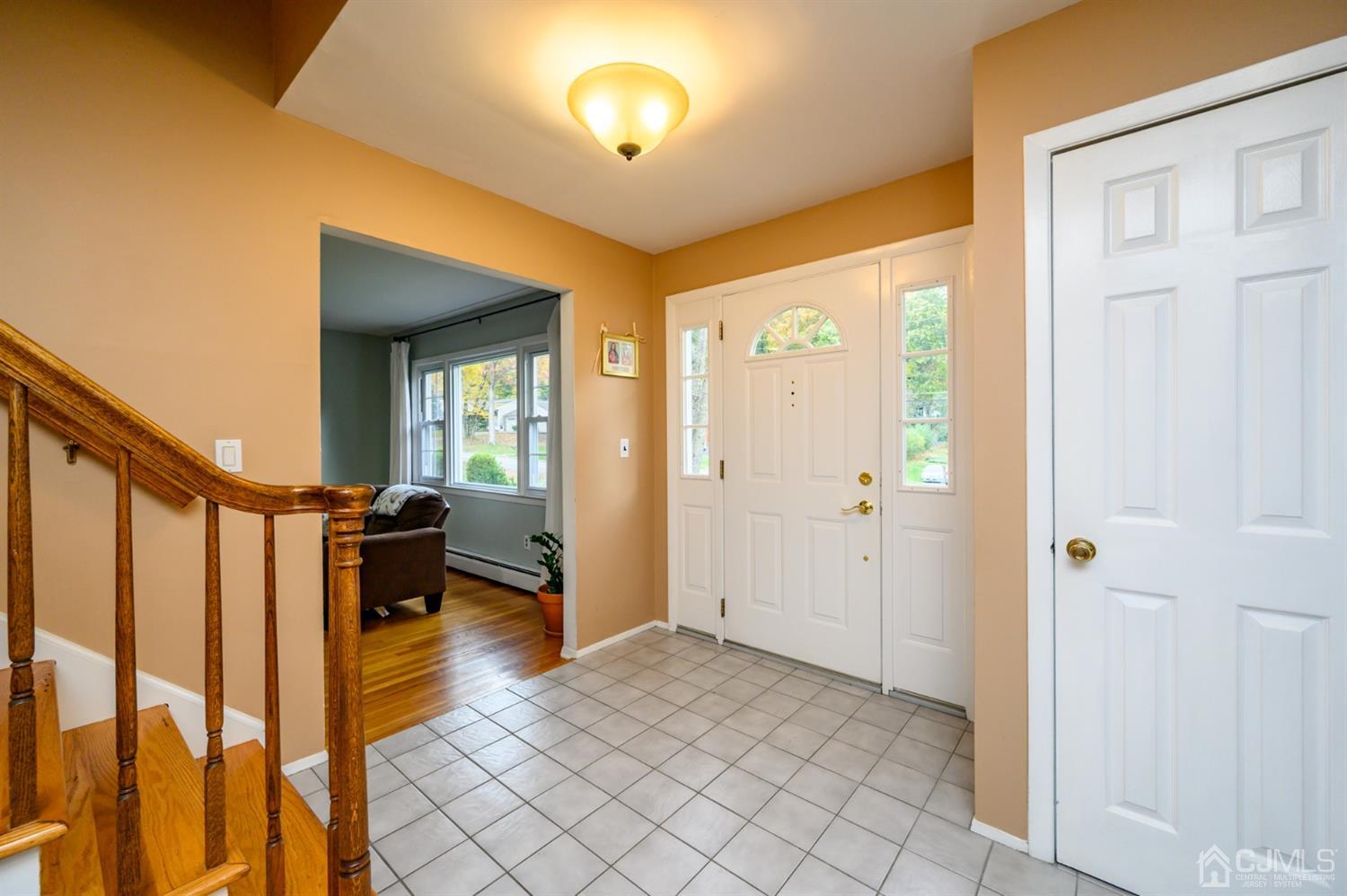 24 Clover Lane Randolph, NJ 07869 - Photo 4 of 59 a view of a hallway with wooden floor and staircase