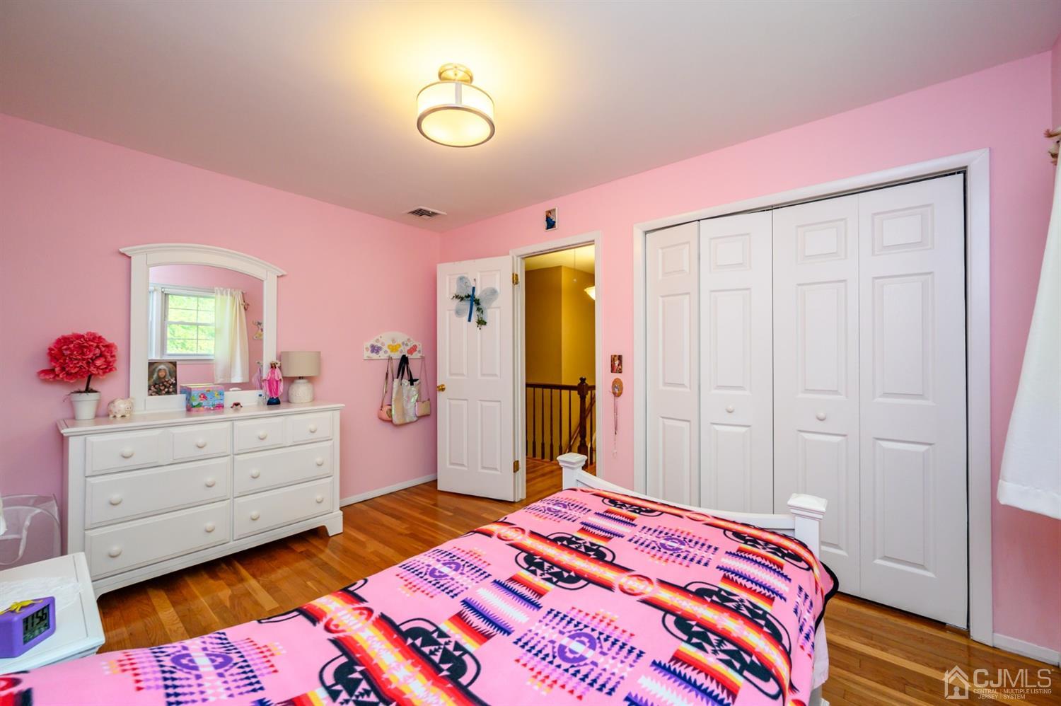 24 Clover Lane Randolph, NJ 07869 - Photo 34 of 59 a bedroom with a bed and a dresser