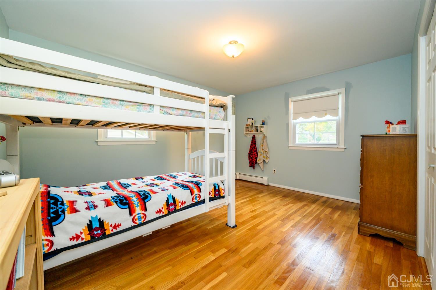 24 Clover Lane Randolph, NJ 07869 - Photo 35 of 59 a bedroom with baby bed and a window