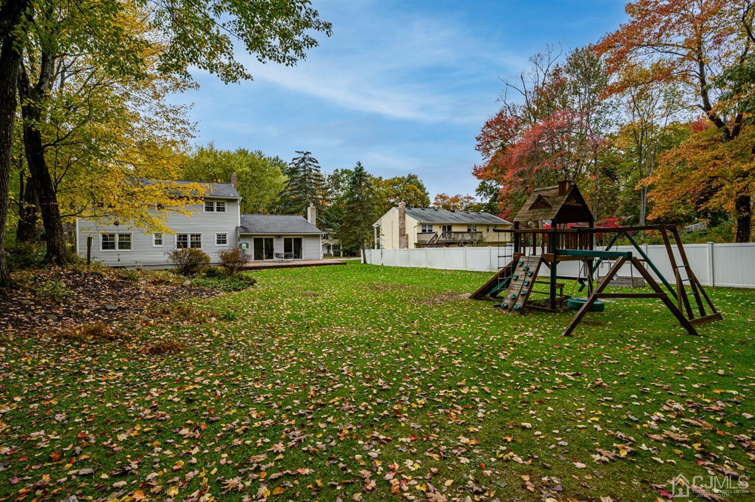 24 Clover Lane Randolph, NJ 07869 - Photo 47 of 59 a view of a garden with a bench