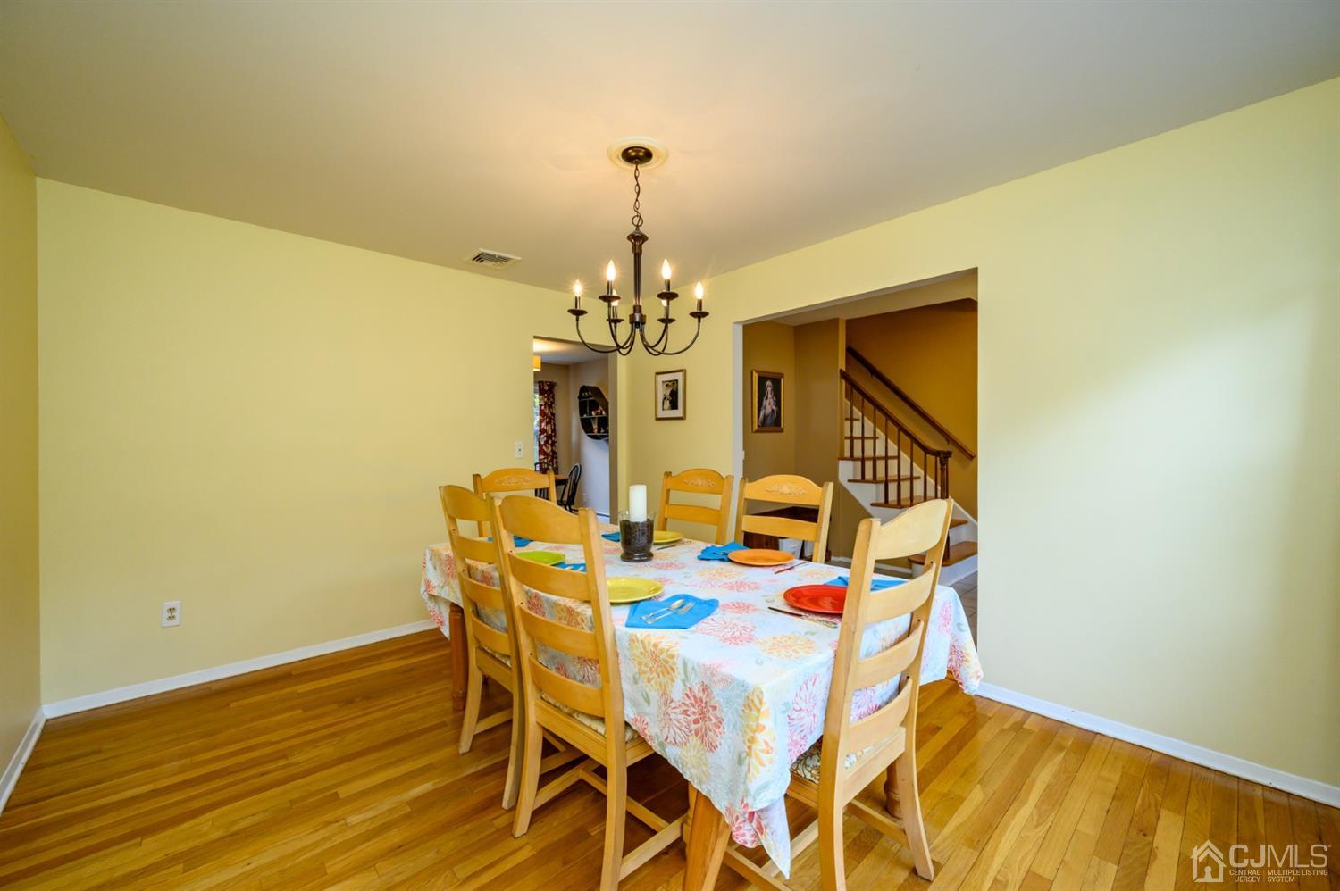 24 Clover Lane Randolph, NJ 07869 - Photo 7 of 59 a view of a dining room with furniture and chandelier