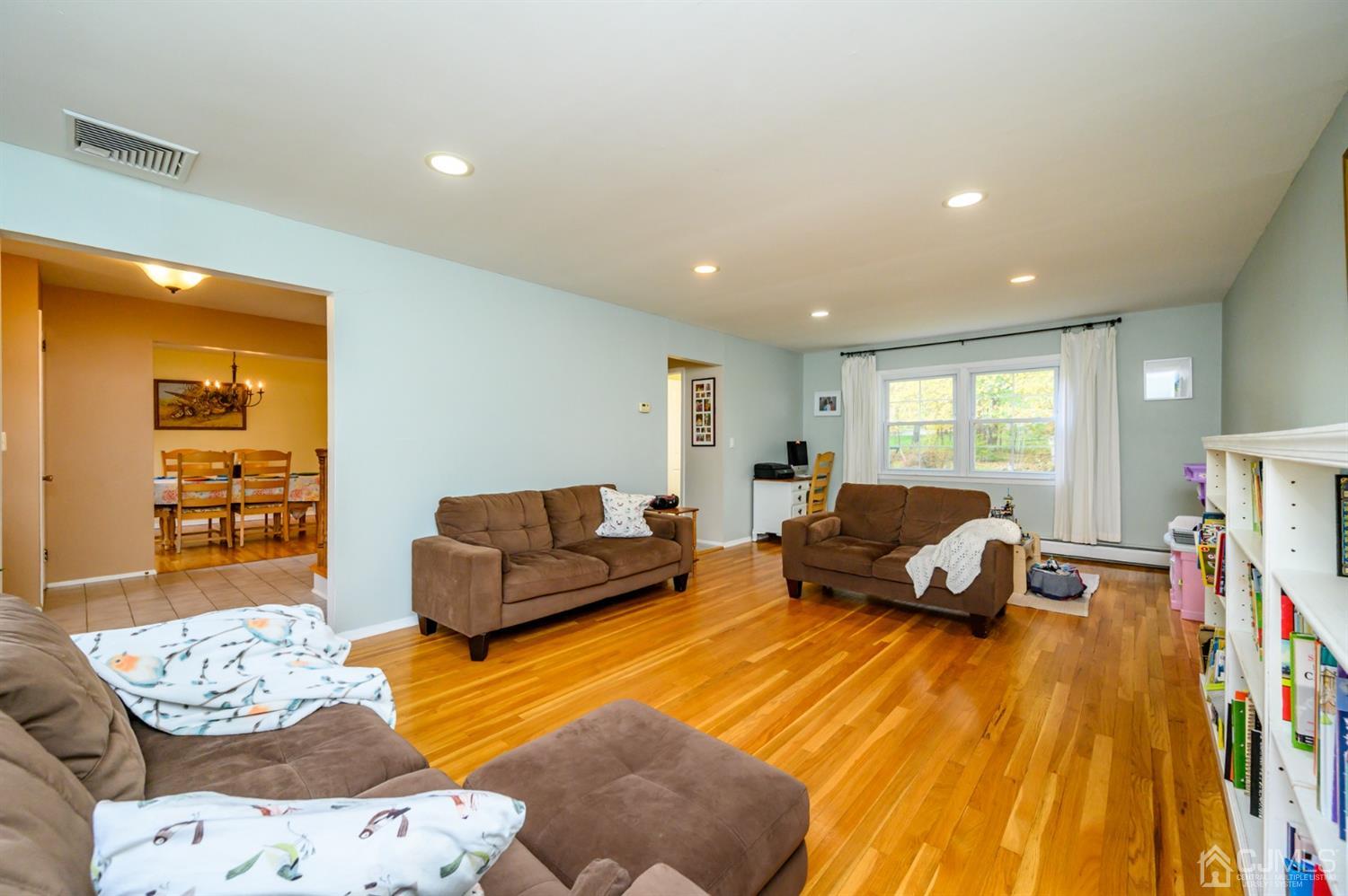 24 Clover Lane Randolph, NJ 07869 - Photo 8 of 59 a living room with furniture and a wooden floor