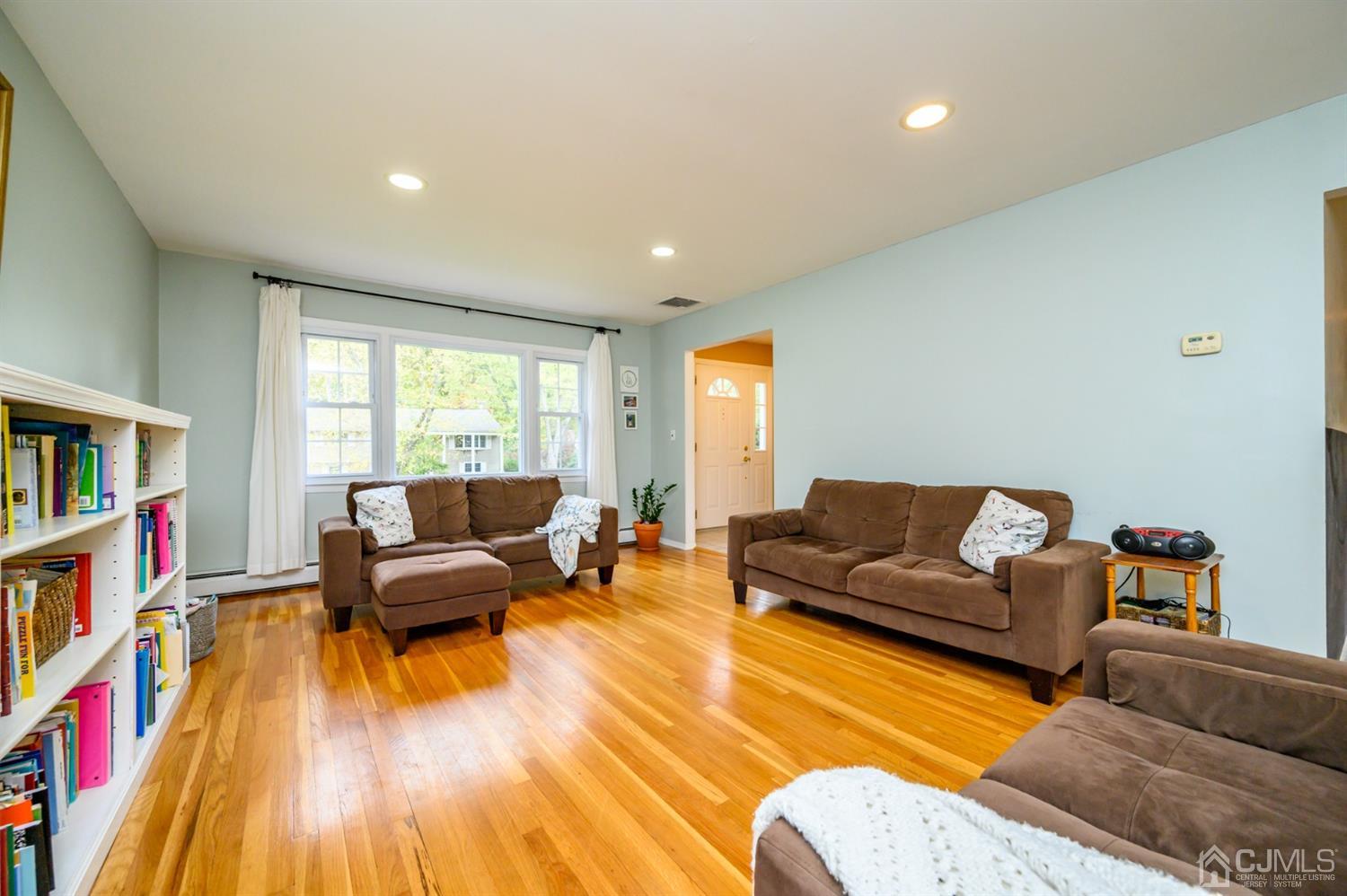 24 Clover Lane Randolph, NJ 07869 - Photo 9 of 59 a living room with furniture and a wooden floor