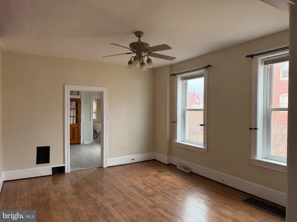 a view of an empty room with a window
