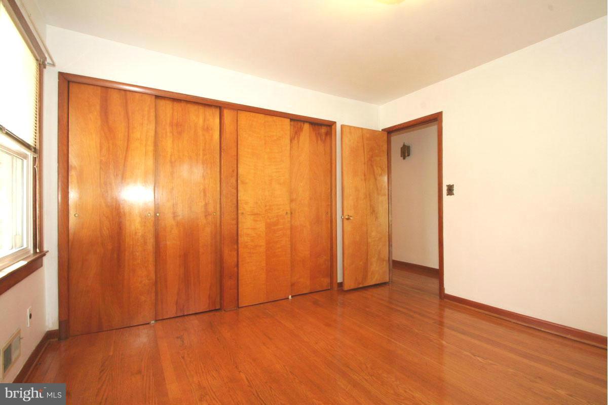 1604 Lynch Road Dundalk, MD 21222 - Photo 11 of 30 a view of a room with wooden floor and windows