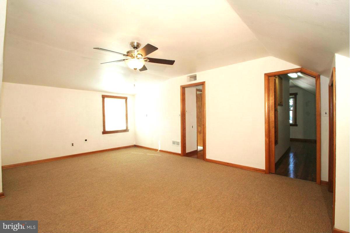 1604 Lynch Road Dundalk, MD 21222 - Photo 13 of 30 a view of a room with a ceiling fan and a window