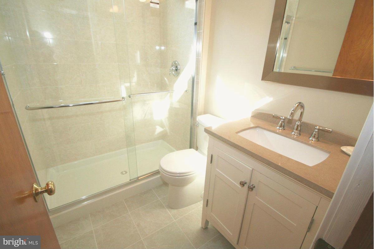 1604 Lynch Road Dundalk, MD 21222 - Photo 4 of 30 a bathroom with a sink a toilet and shower
