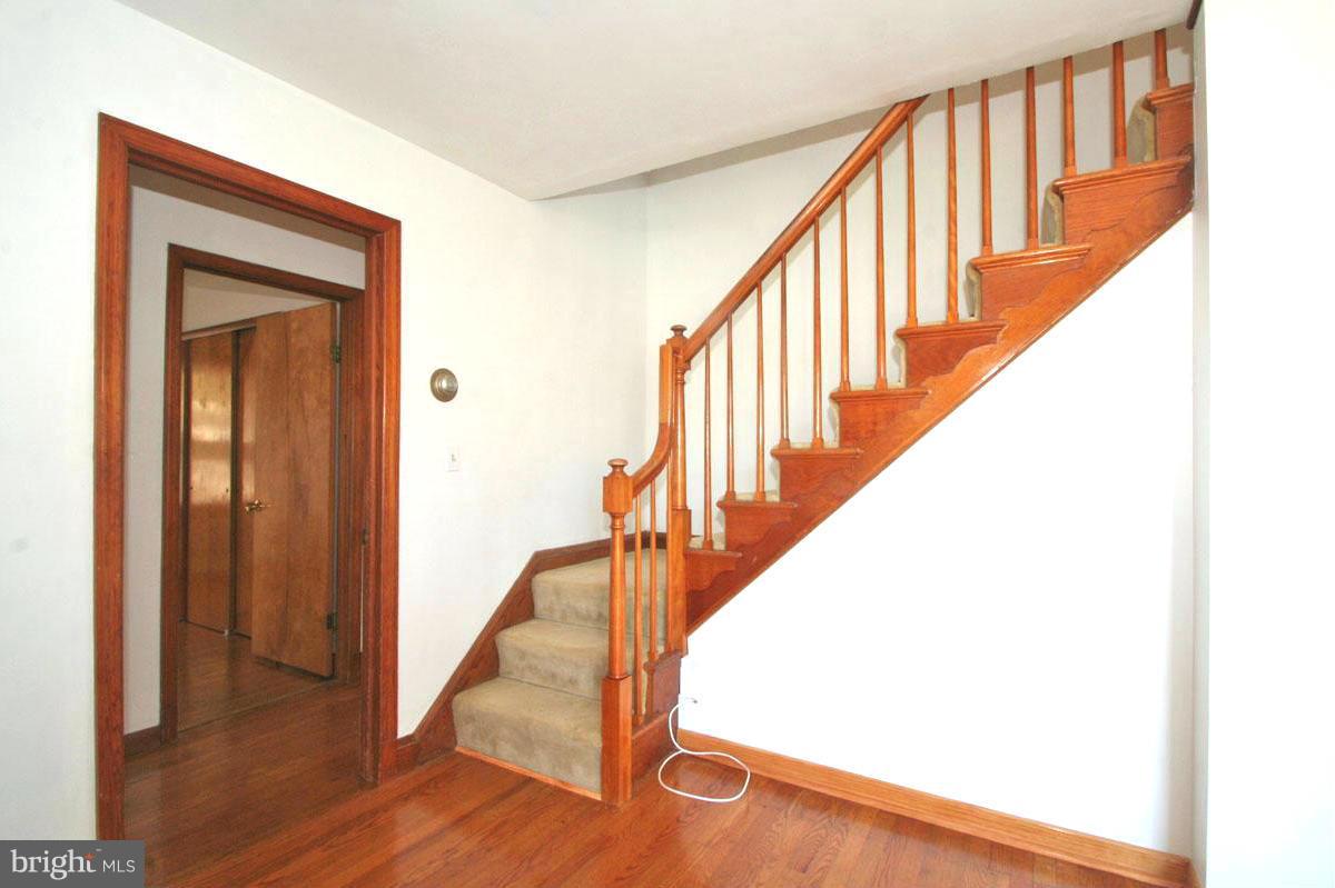 1604 Lynch Road Dundalk, MD 21222 - Photo 5 of 30 a view of staircase with railing and a wooden floor