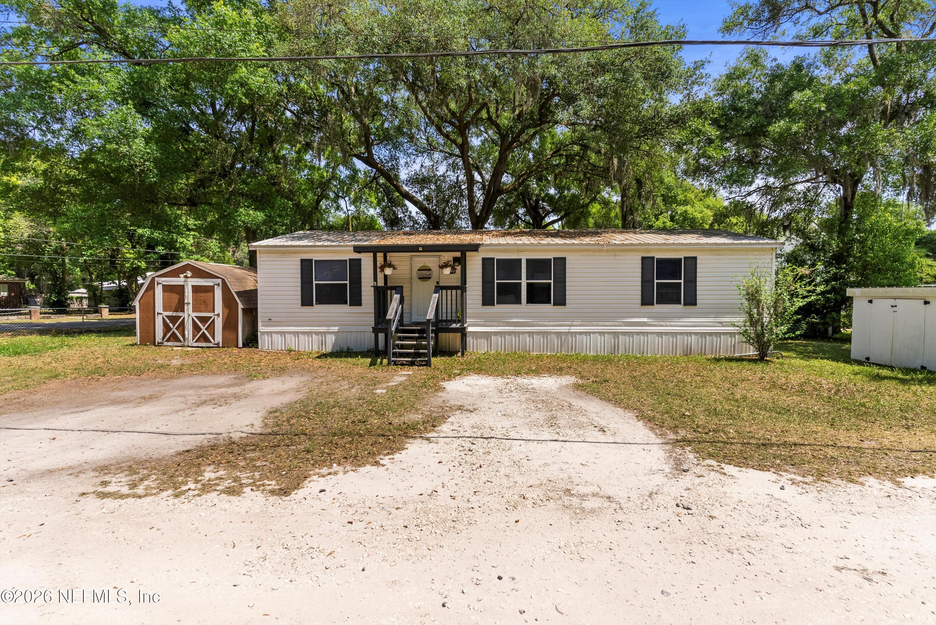 a house view with a backyard space