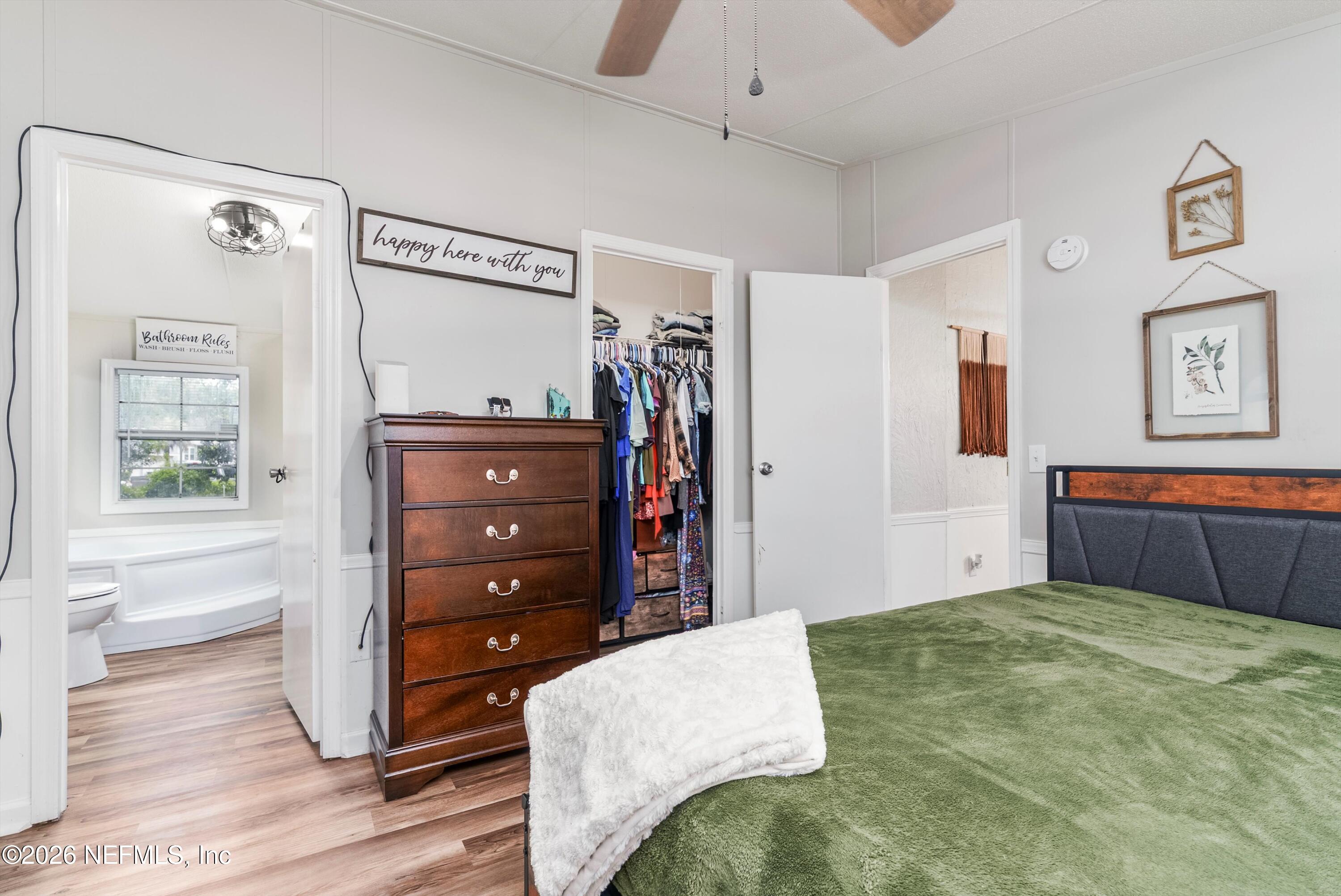 85246 Johnson Lane Yulee, FL 32097 - Photo 17 of 46 a bedroom with a bed and a dresser