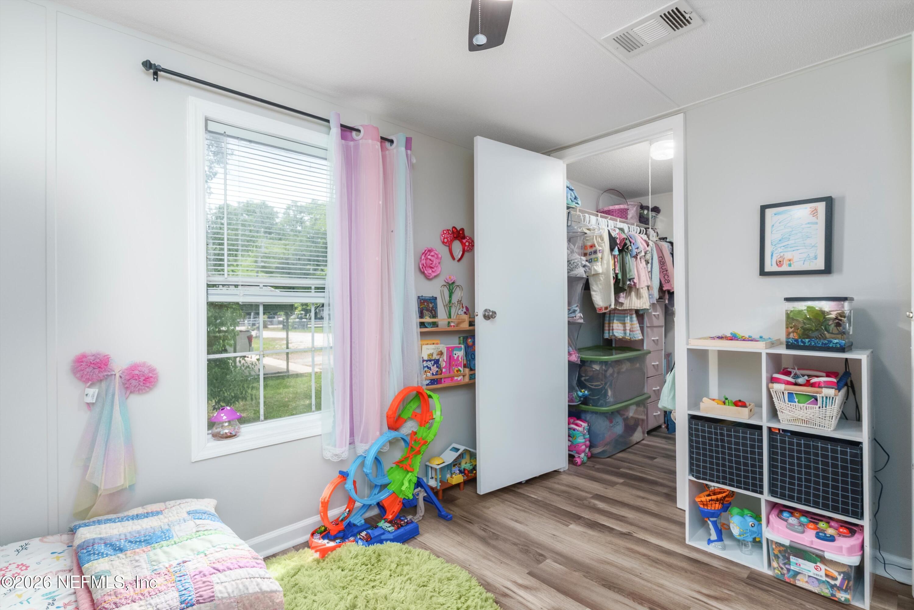 85246 Johnson Lane Yulee, FL 32097 - Photo 25 of 46 a children room with toys and a wooden floor