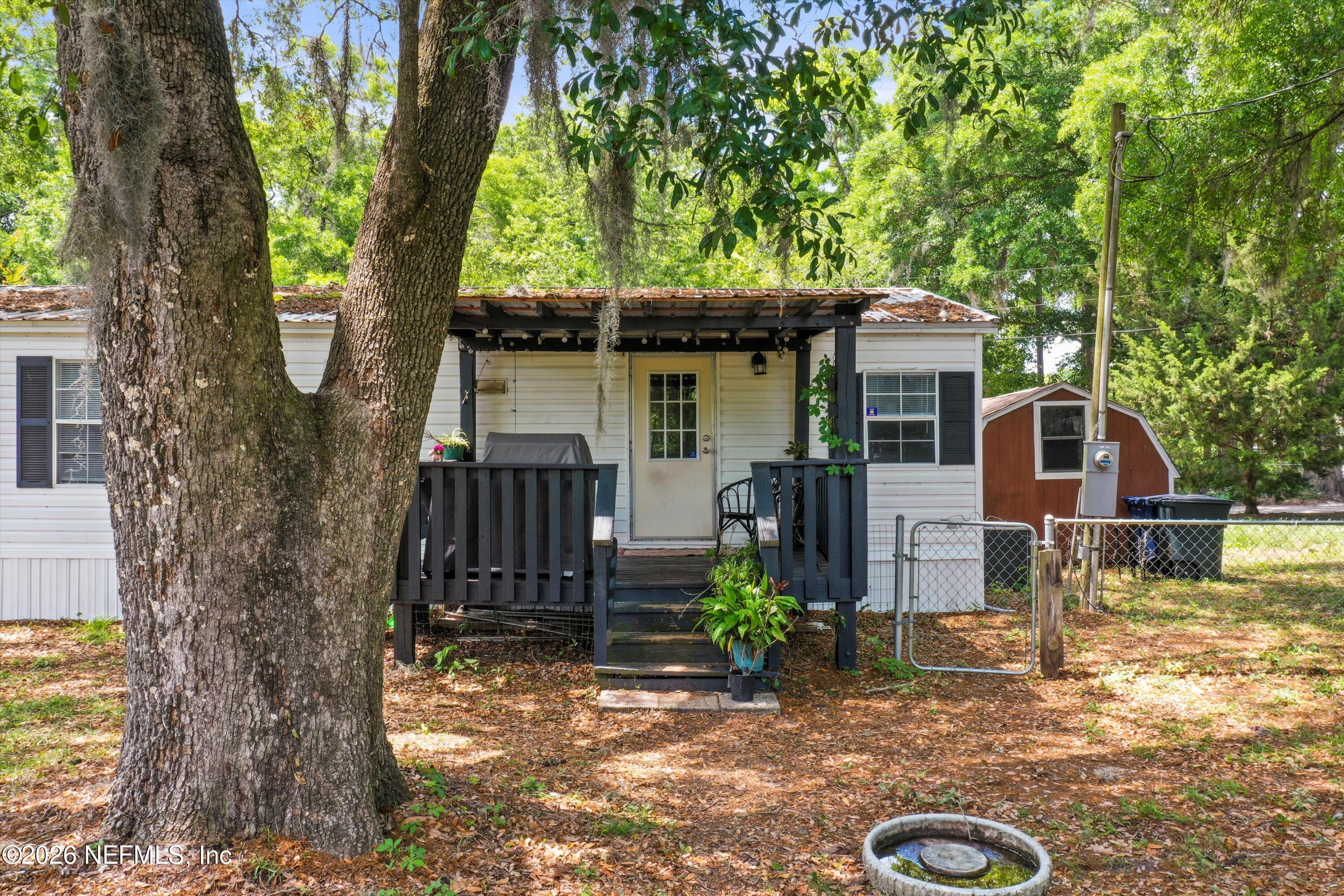 85246 Johnson Lane Yulee, FL 32097 - Photo 29 of 46 a front view of a house with garden