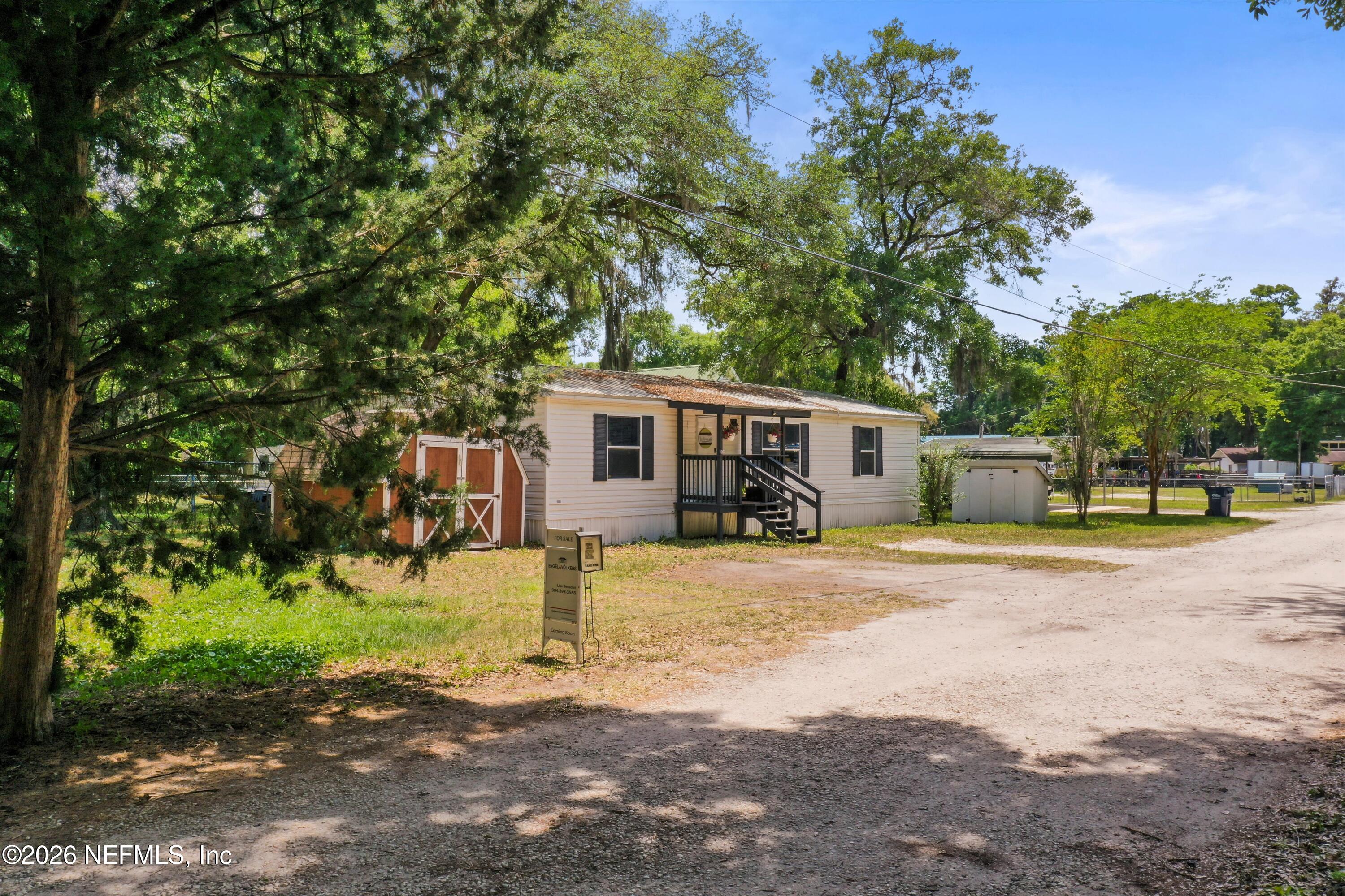 85246 Johnson Lane Yulee, FL 32097 - Photo 41 of 46 a front view of a house with a yard and garage