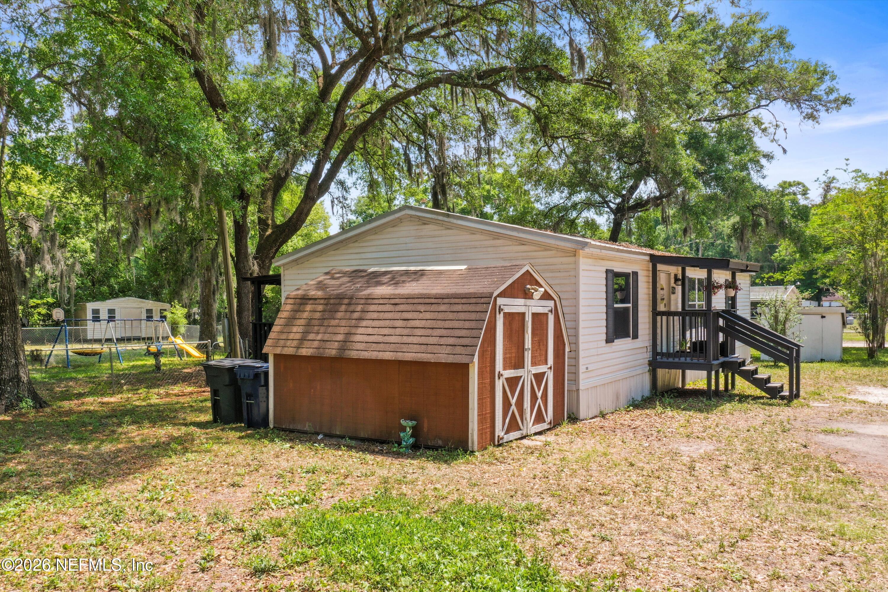 85246 Johnson Lane Yulee, FL 32097 - Photo 42 of 46 a view of a house with a yard