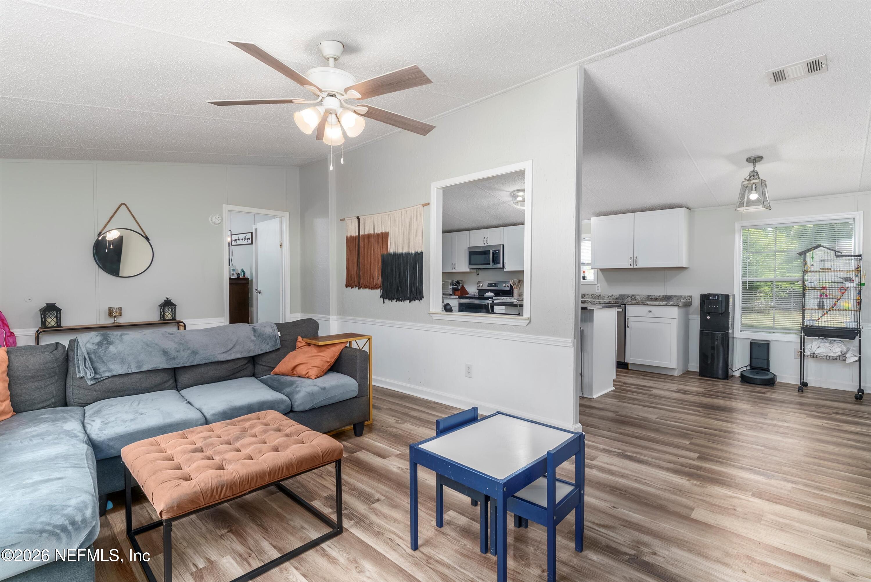 85246 Johnson Lane Yulee, FL 32097 - Photo 9 of 46 a living room with furniture and wooden floor