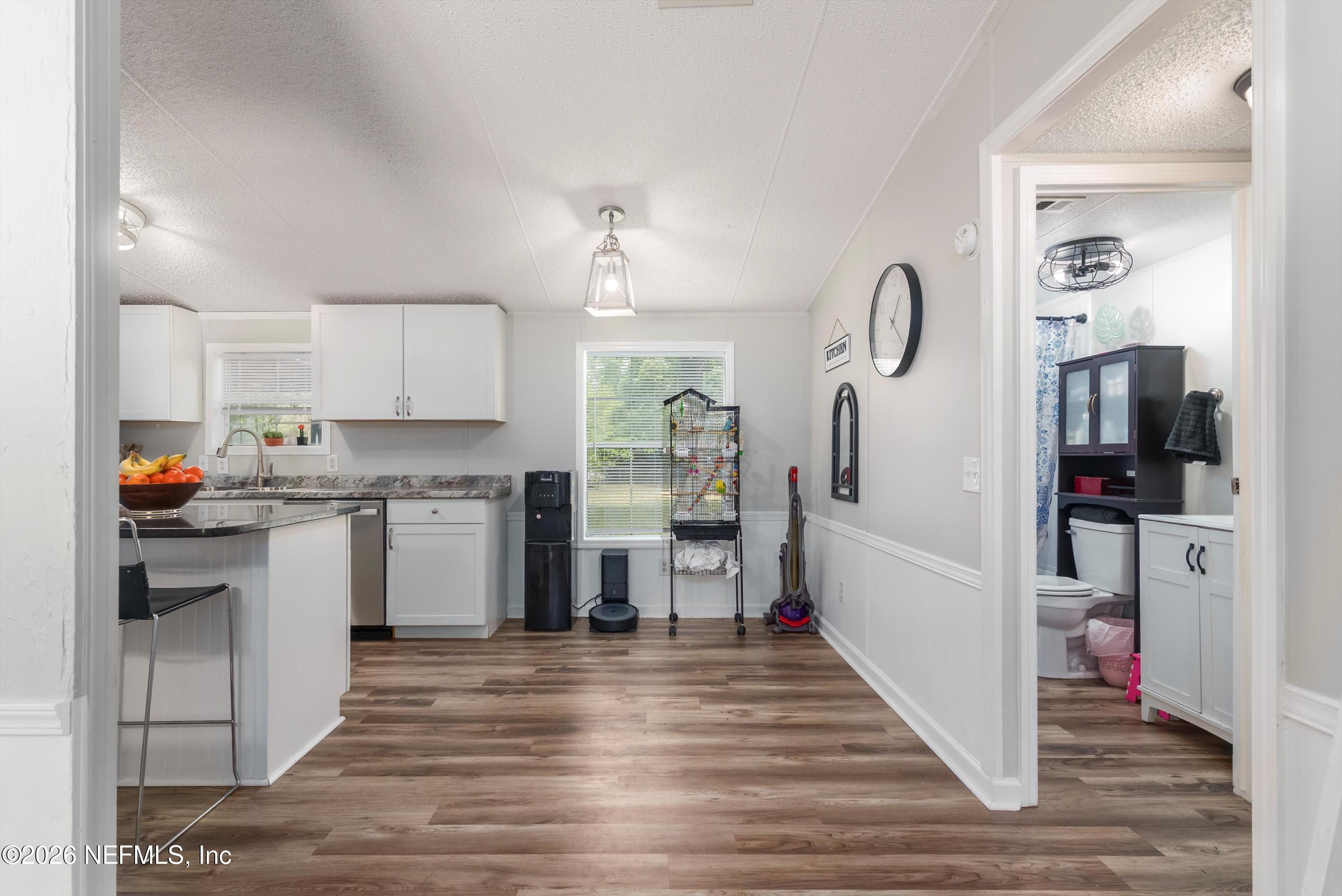 85246 Johnson Lane Yulee, FL 32097 - Photo 10 of 46 a kitchen with a refrigerator and a sink