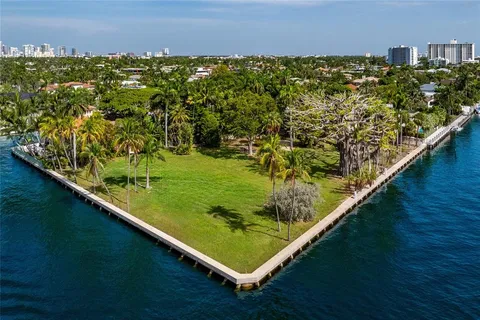 an aerial view of a house with a lake view