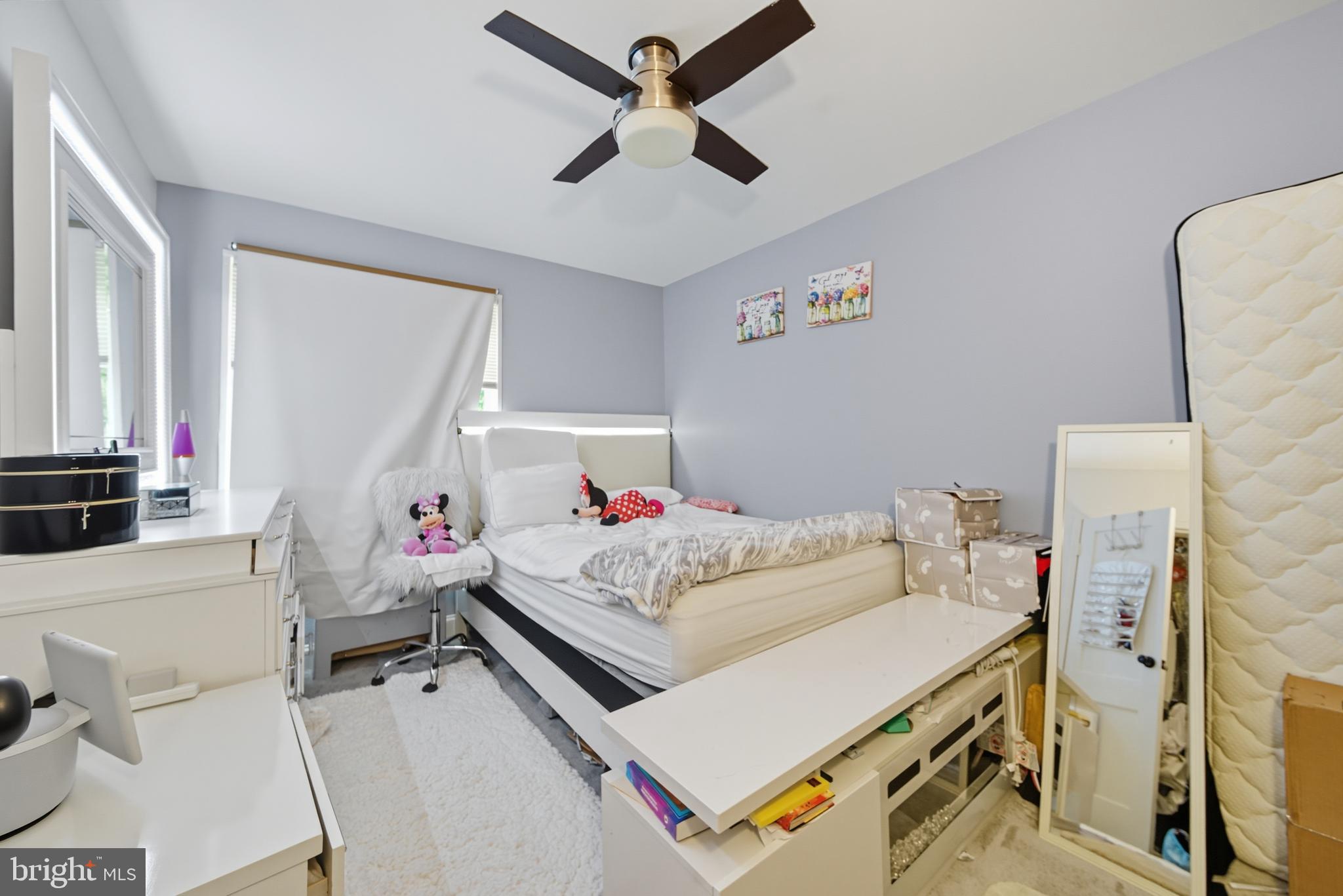10305 Montrose Avenue, Unit 10305 Bethesda, MD 20814 - Photo 14 of 16 a living room with furniture and a flat screen tv