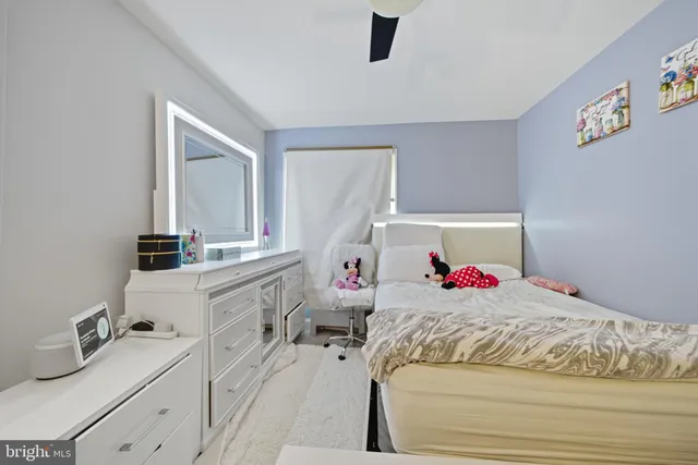 a bedroom with a bed and a dresser