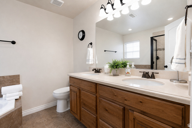 896 Cres Drive South Mapleton, UT 84664 - Photo 15 of 32 Dual vanity with wood-finish cabinetry and integrated sinks