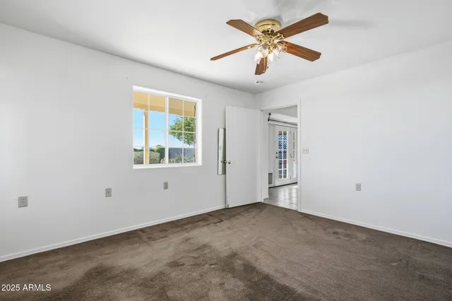 a view of an empty room and window