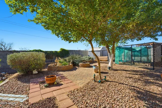a view of a backyard with sitting area