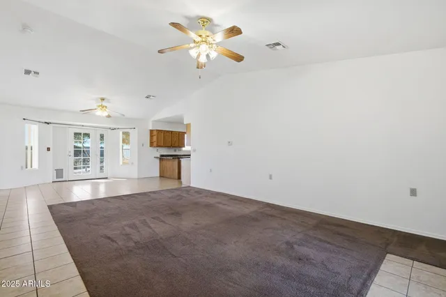 a view of a hallway with wooden shelves