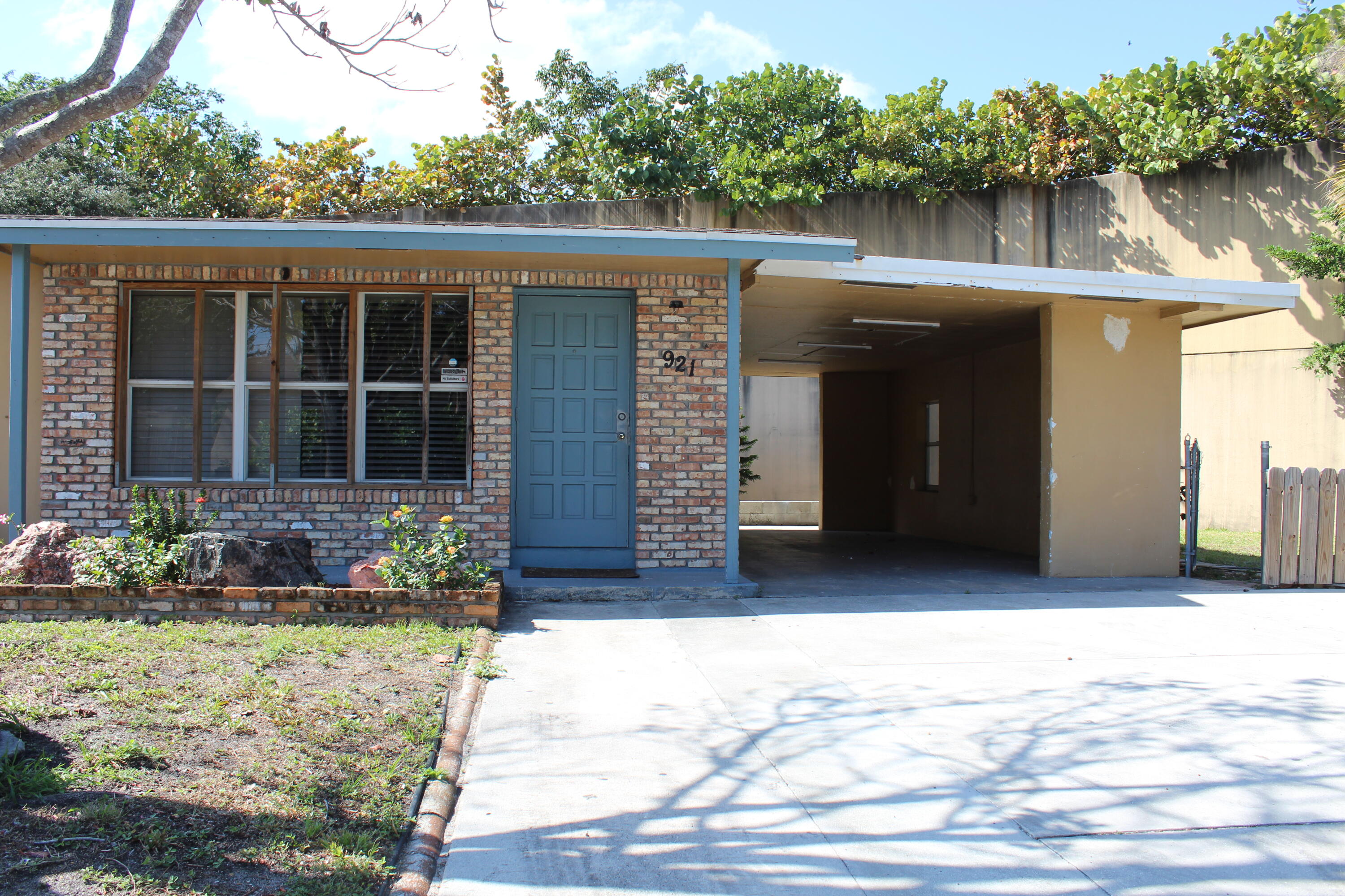 921 Pine Terrace Lake Worth Beach, FL 33460 - Photo 2 of 10 a house view with a garden space