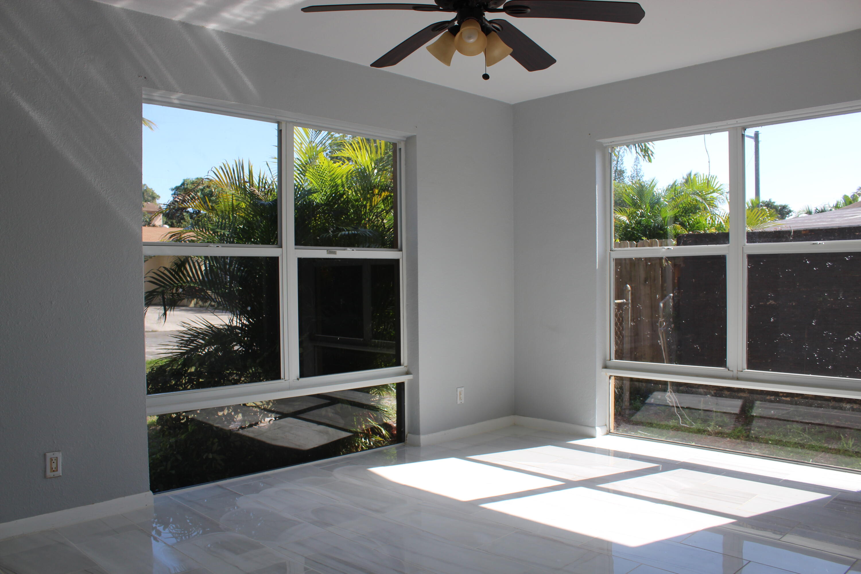 921 Pine Terrace Lake Worth Beach, FL 33460 - Photo 6 of 10 a living room with a large window