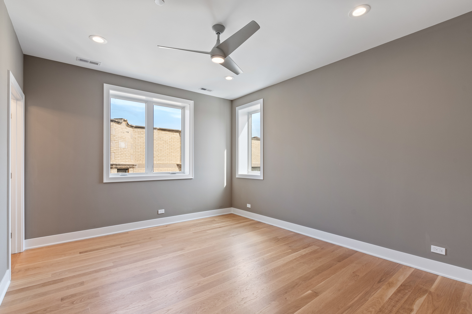 Undisclosed Address Chicago, IL 60640 - Photo 7 of 12 wooden floor in an empty room with a window