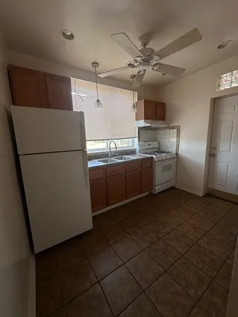 a kitchen with stainless steel appliances a refrigerator and a sink