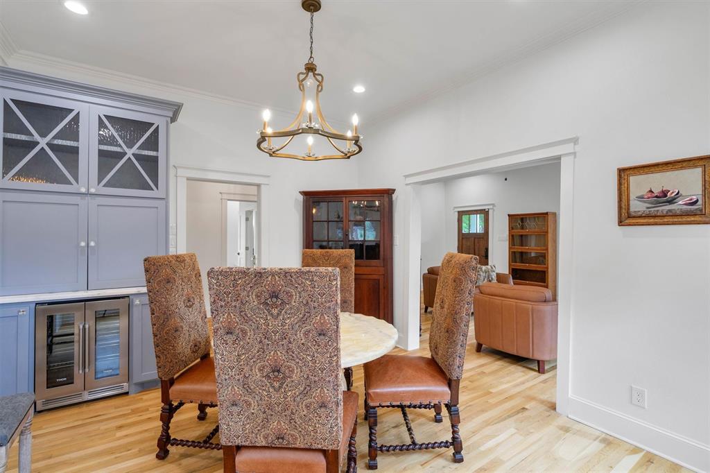 5727 Victor Street Dallas, TX 75214 - Photo 15 of 40 a view of a dining room with furniture and wooden floor